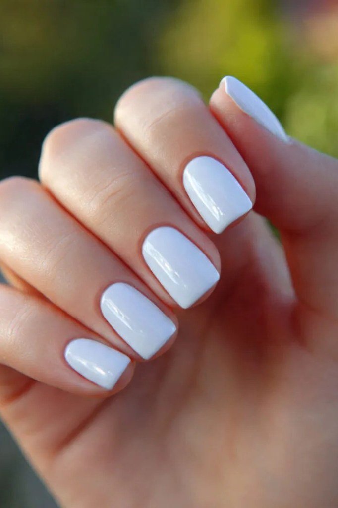 Ivory white almond nails with glossy finish, summer nail color for women over 40