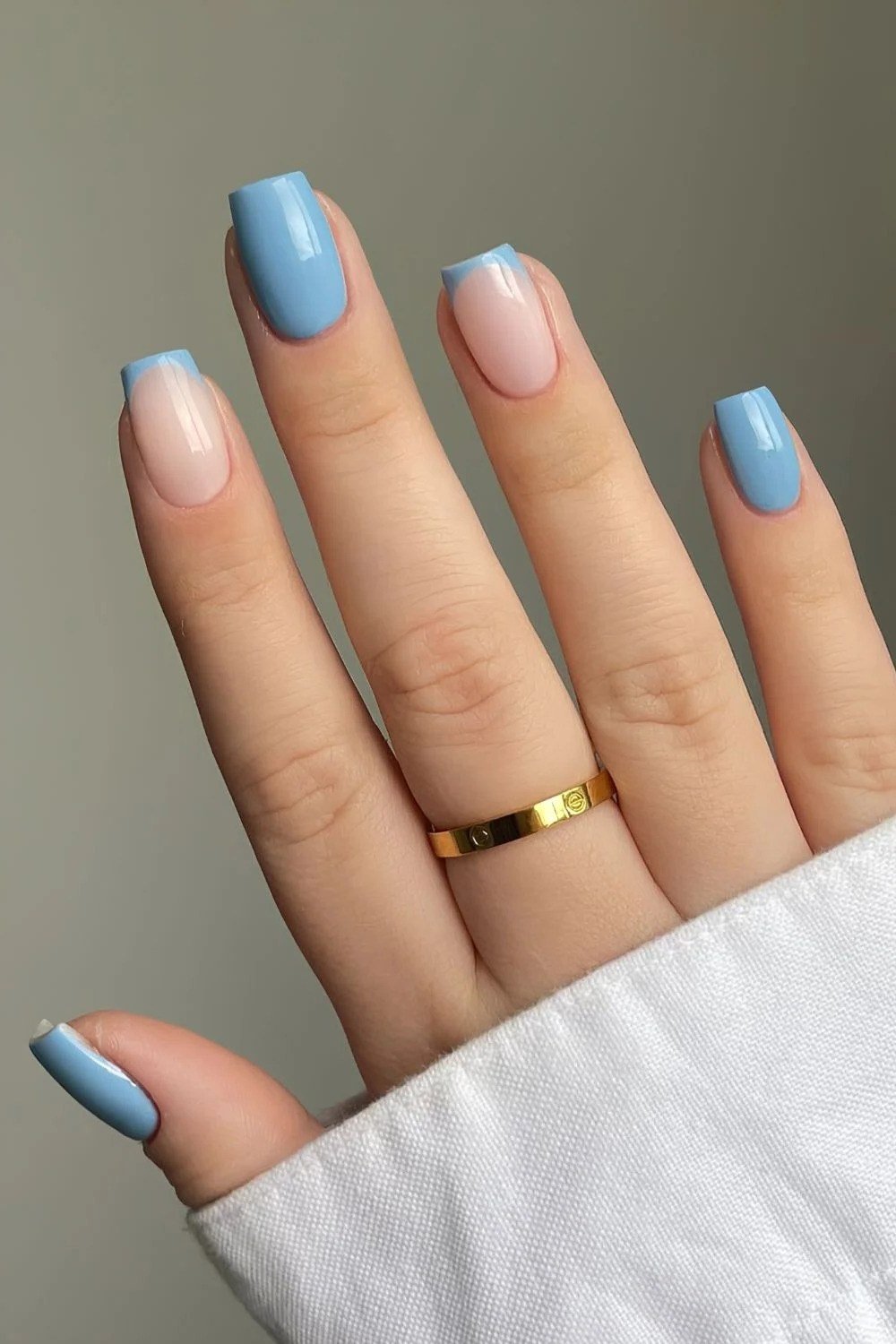 Sky blue and nude nails with sky blue French tips and gold ring, summer nail art