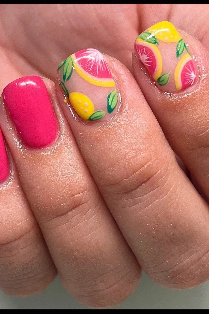 Hot pink nails with lemon and grapefruit citrus slice nail art, fun summer nails