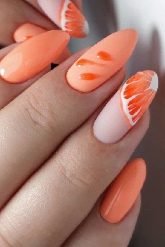 Peach almond nails with orange citrus slice nail art, juicy summer fruit nails