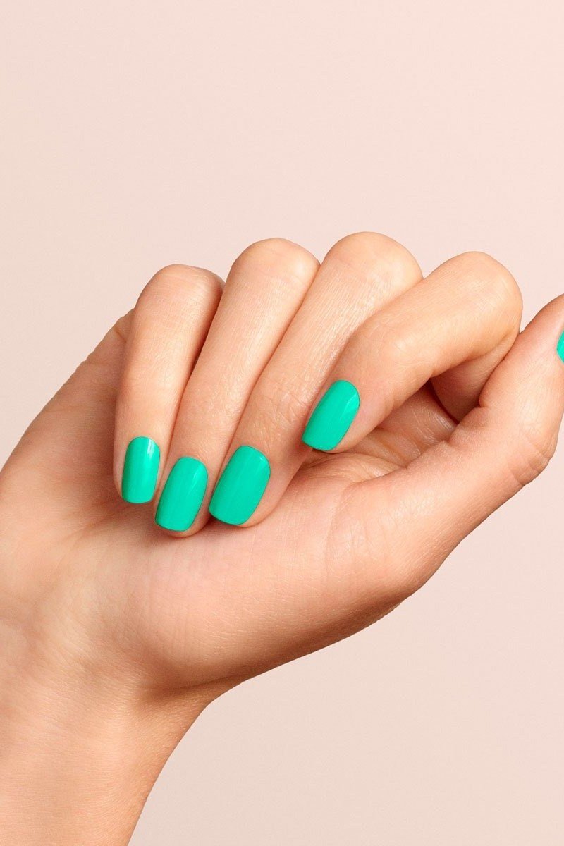 Bright mint aqua green short oval nails with glossy finish, cheerful summer nails