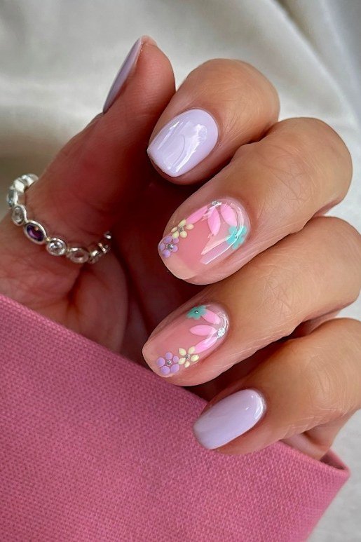 Lavender nails with pink sheer accents and tiny pastel flower nail art, dainty summer nails