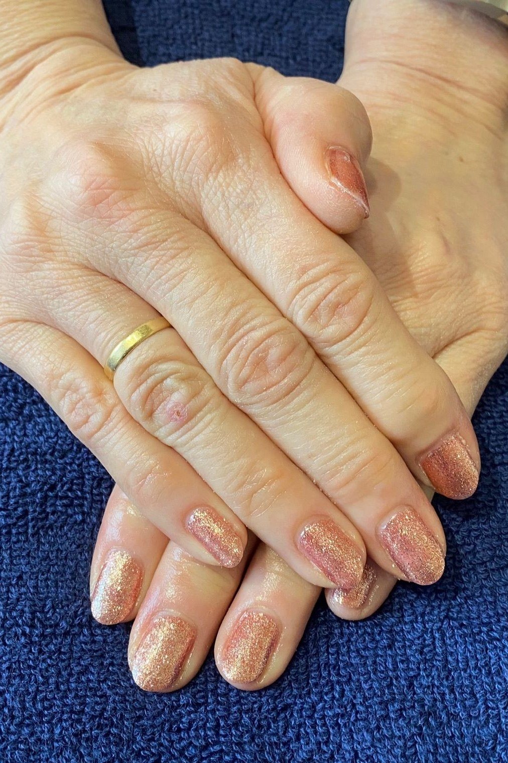 Sheer nude nails on older hands, fresh spa manicure