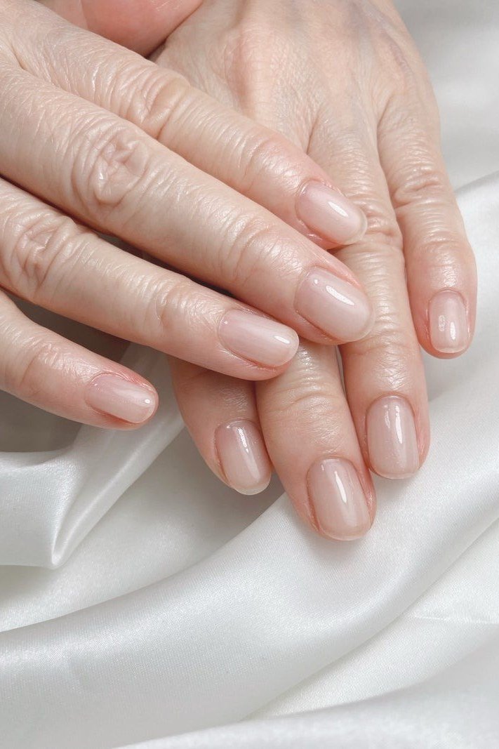 Silk sheer nude nails on older hands