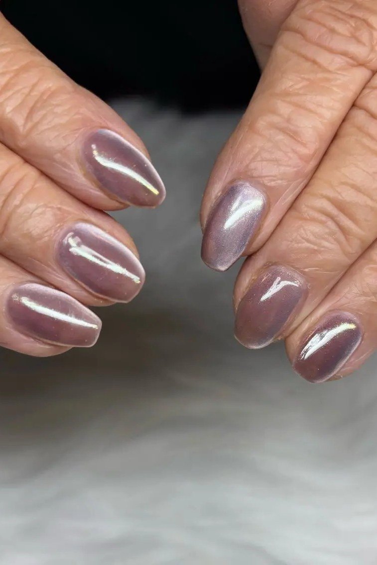 Rose gold chrome nails on older hands