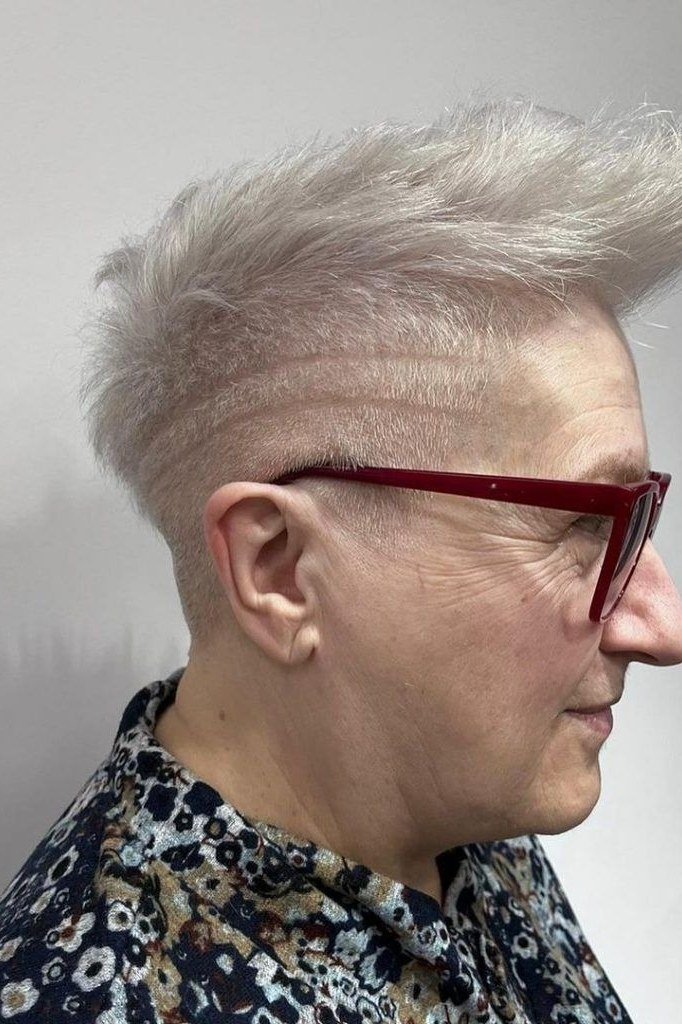 White pixie haircut for women over 60 with red glasses