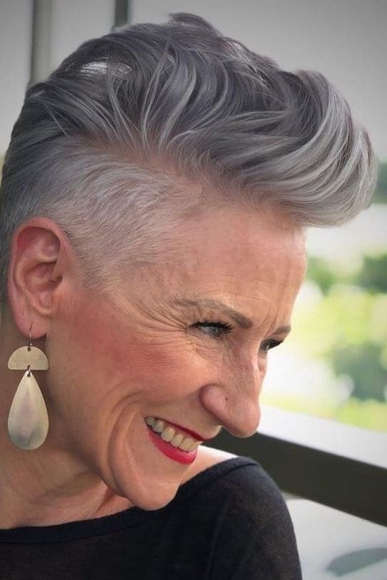 Joyful silver pixie haircut for women over 60, laughing