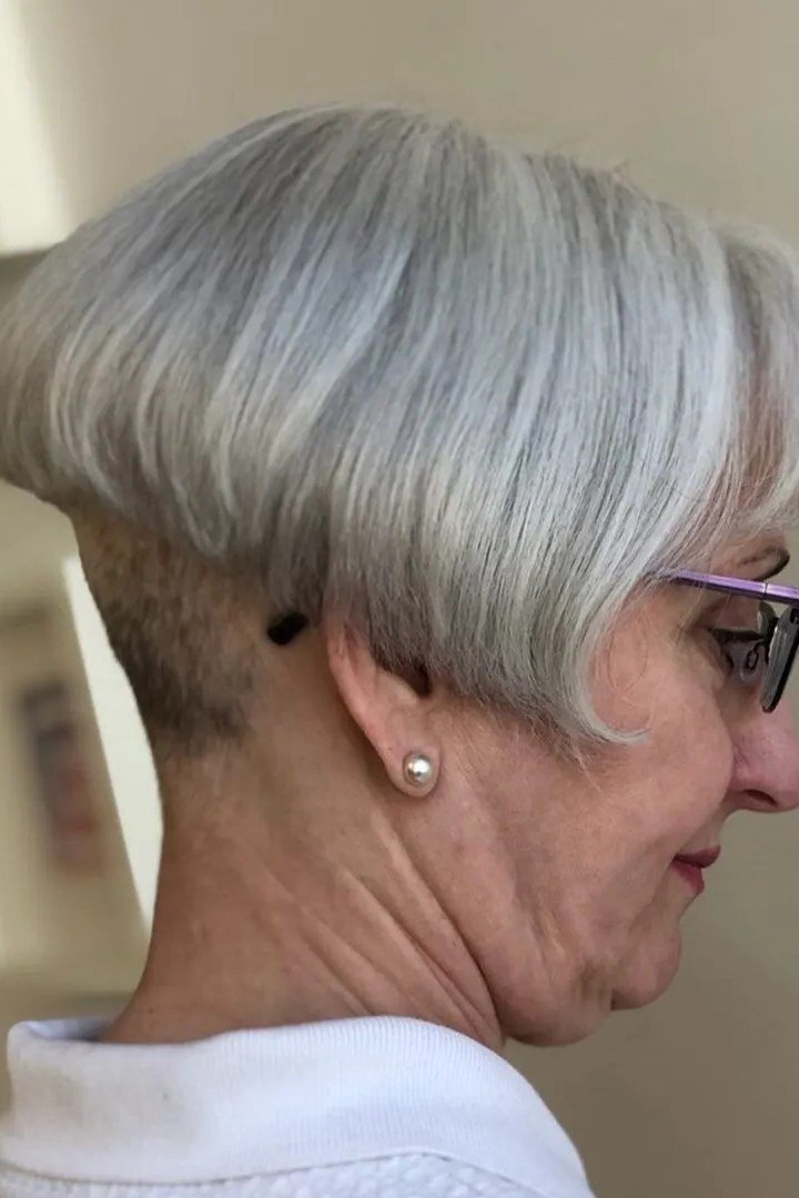 Gray pixie with undercut nape for women over 60, side view