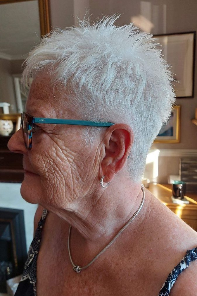 Auburn pixie haircut for women over 60, front view