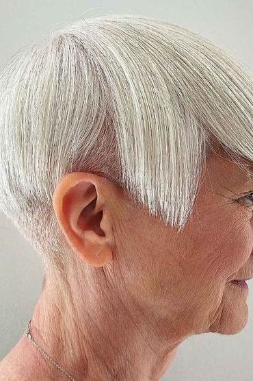 White pixie with undercut line for women over 60, side view
