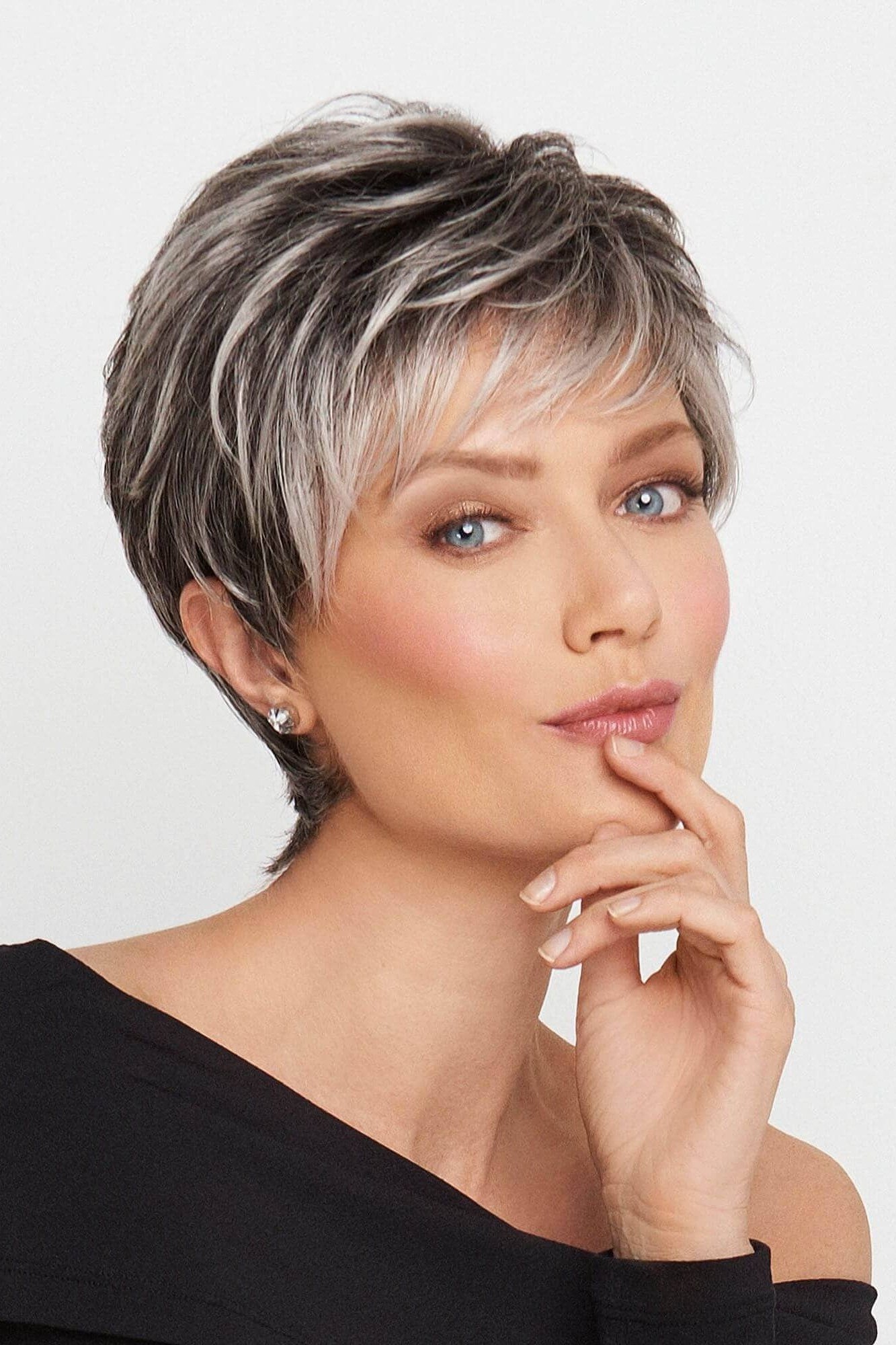 Gray pixie haircut for women over 60, studio portrait