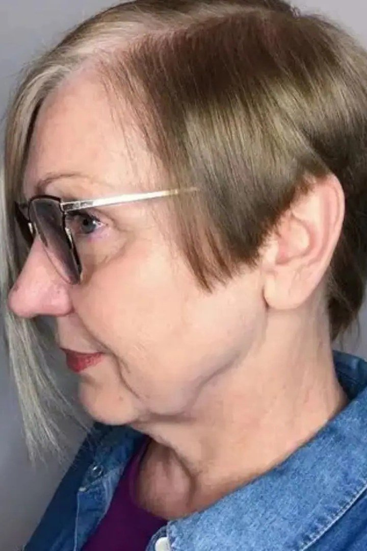 Gray pixie bob haircut for women over 60 with glasses, side view