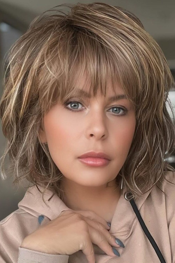 blonde shaggy textured bob with bangs - textured bob haircut idea for women over 60