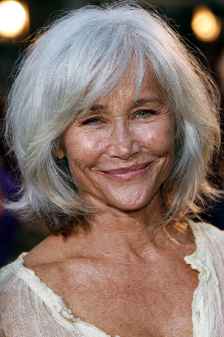 Layered bob haircut for thin fine hair over 50, front view, white layered bob with gentle waves