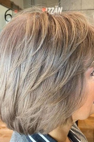 Layered bob haircut for thin fine hair over 50, side view, gray layered bob with volume