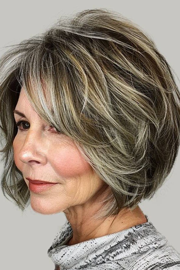 Layered bob haircut for thin fine hair over 50, side view, salt-and-pepper layered bob