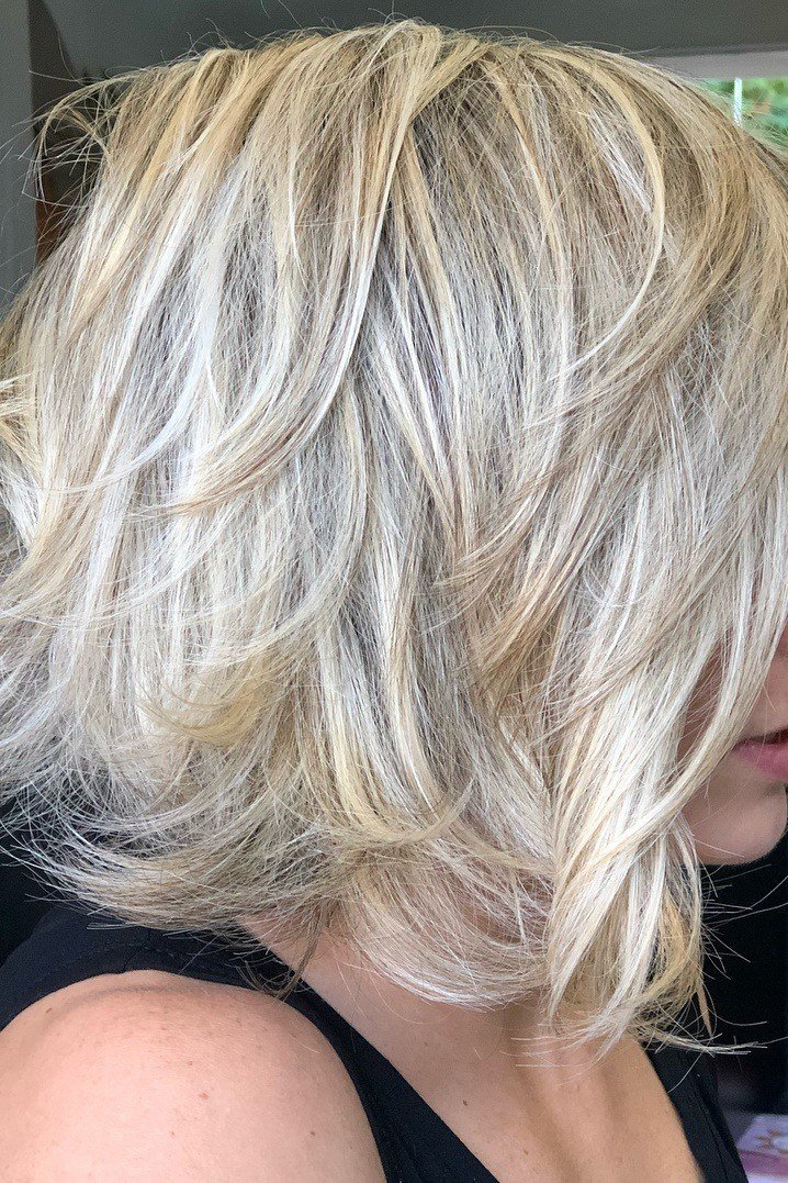 Layered bob haircut for thin fine hair over 50, side view, silver layered bob with piecey texture