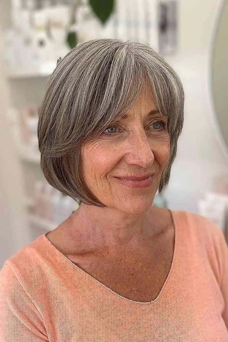 Layered bob haircut for thin fine hair over 50, front view, gray layered bob