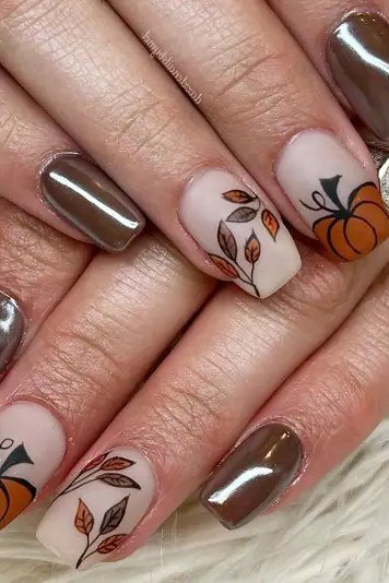 Chrome brown nails with pumpkin and leaf nail art