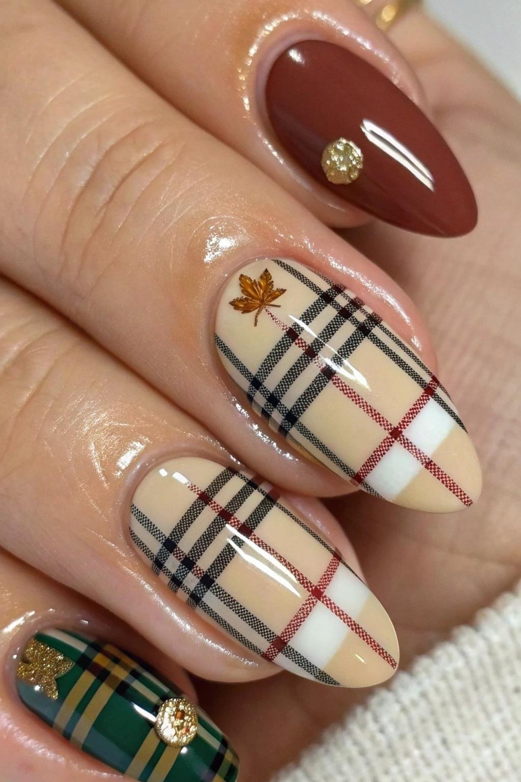 Beige and brown plaid nails with tiny maple leaf