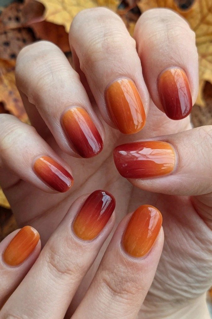 Burnt orange to red ombre almond nails