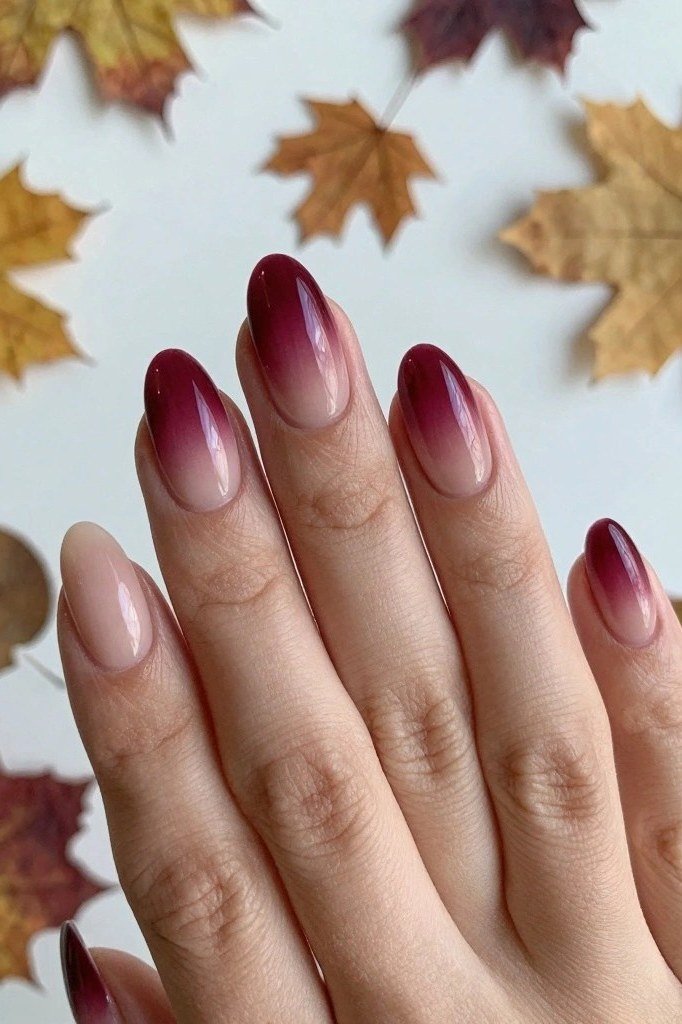 Burgundy to nude ombre almond nails