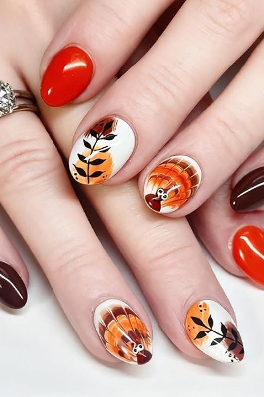 Red and brown nails with turkey and leaf nail art