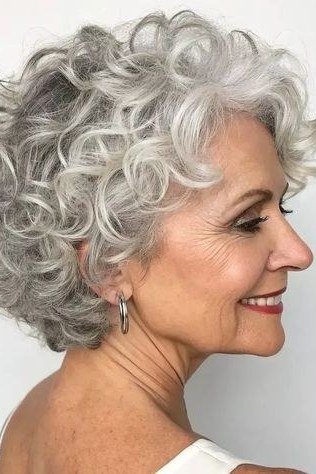 White Curly Shag with Face-Framing Layers short haircut for women over 60 with thin curly hair