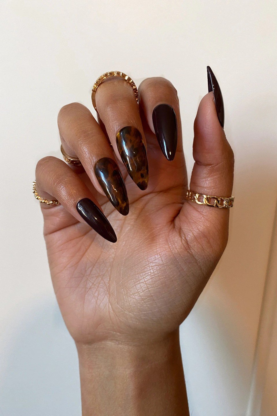 Tortoiseshell nail design: Espresso Stiletto Nails with Gold Rings for women over 50