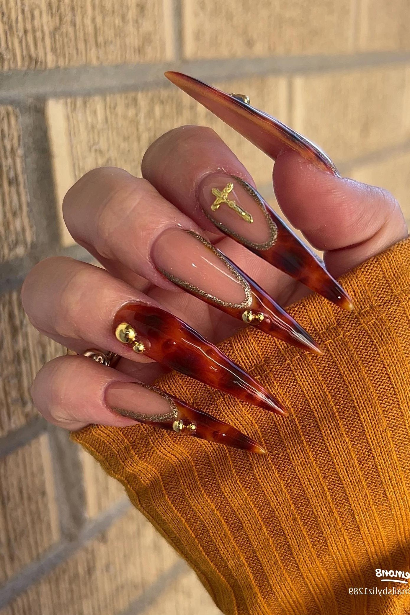 Tortoiseshell nail design: Long Amber Tortoise Stiletto for women over 50