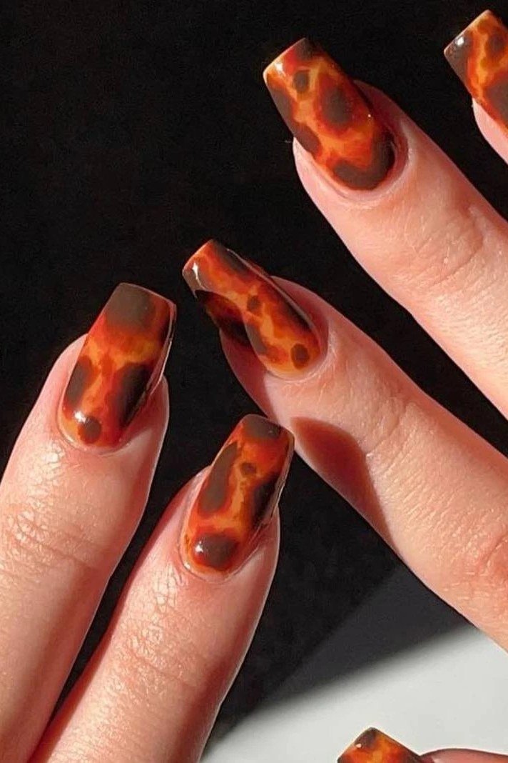Tortoiseshell nail design: Bright Amber Tortoise Almond for women over 50