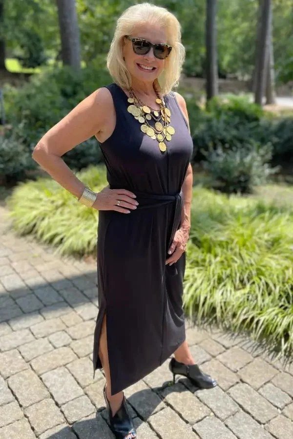Sleeveless Navy Maxi with Front Slit and Statement Necklace, travel outfit for women over 70