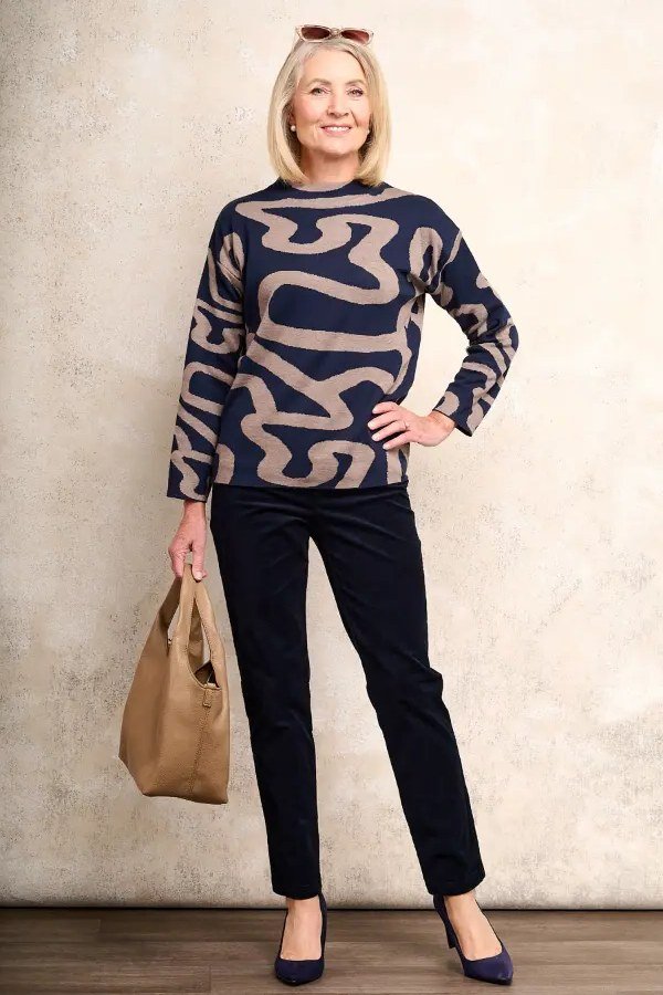 Navy Abstract-Pattern Sweater with Black Pants and Tan Tote, travel outfit for women over 70