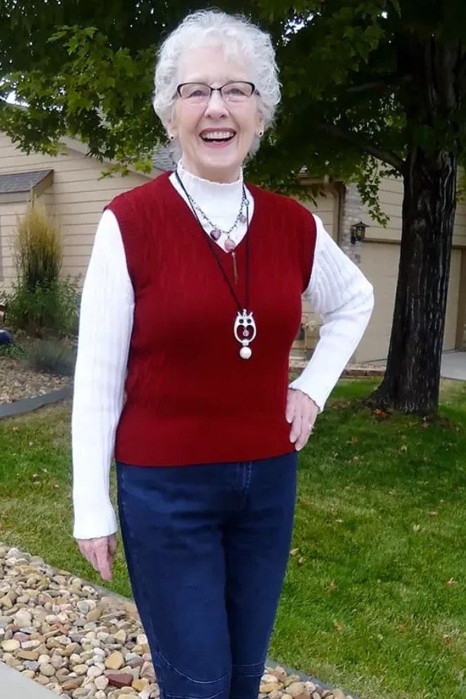 Red Sweater Vest over White Shirt with Jeans, travel outfit for women over 70