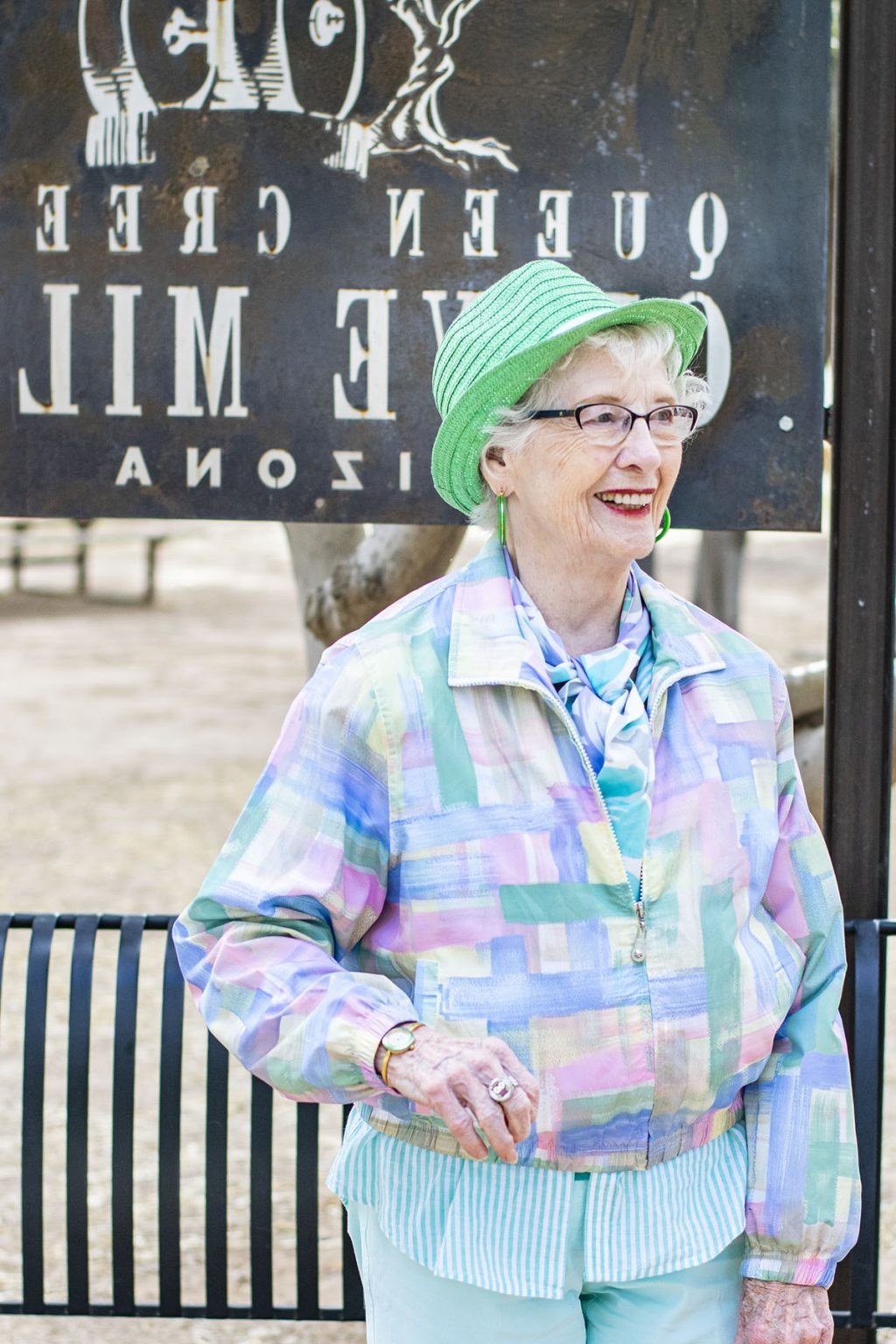 Green Cap with Pastel Plaid Jacket, travel outfit for women over 70
