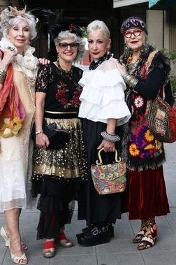 Four women in bohemian colorful outfits together - trendy outfits for women over 70