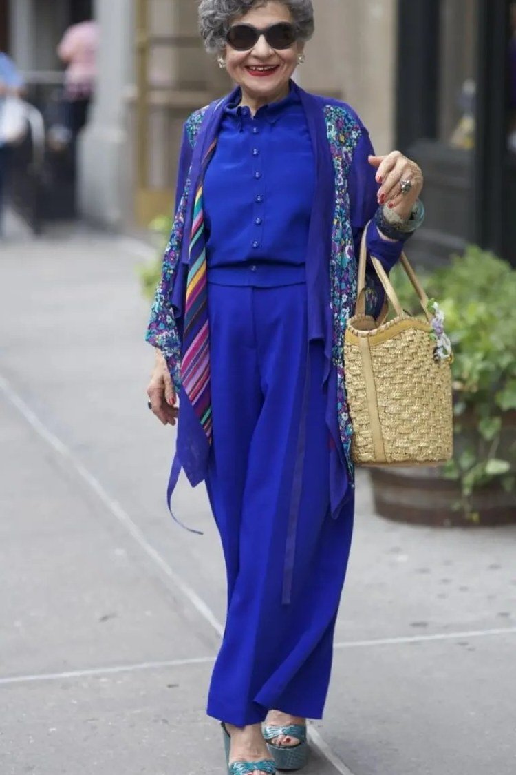 Older woman cobalt blue jumpsuit with colorful kimono - trendy outfit idea for women over 70