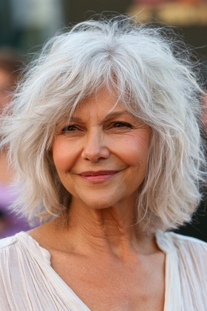 Voluminous White Shaggy Bob - textured shaggy bob hairstyle for women over 60