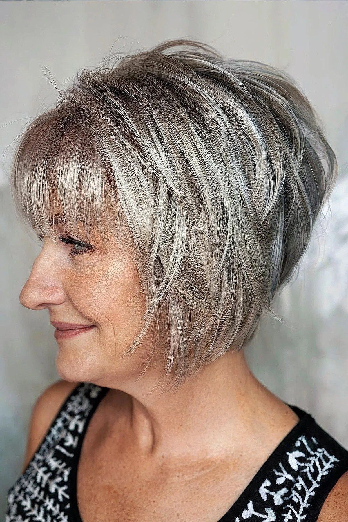 Layered Silver Shaggy Bob - textured shaggy bob hairstyle for women over 60