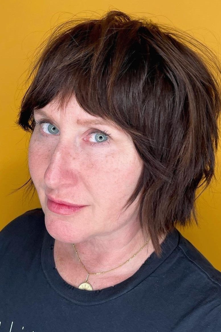 Espresso Shaggy Bob with Bangs - textured shaggy bob hairstyle for women over 60