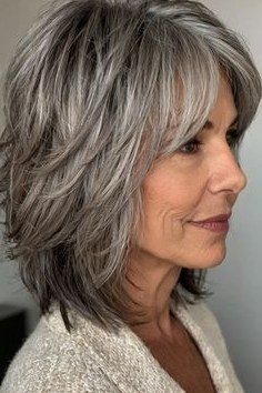 Gray Textured Shaggy Bob with Side Sweep - textured shaggy bob hairstyle for women over 60