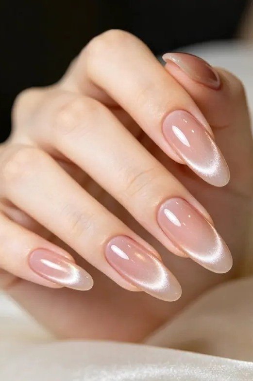 Nude pink cat eye, long almond, glossy - nail ideas for women over 40