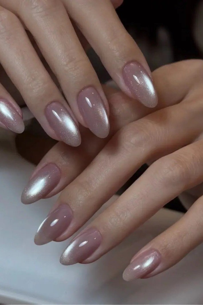 Mauve cat eye, glossy almond - nail ideas for women over 40