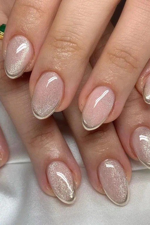 Nude cat eye with gold sparkle, oval - nail ideas for women over 40