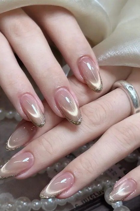 Champagne cat eye with pearls and rings - nail ideas for women over 40