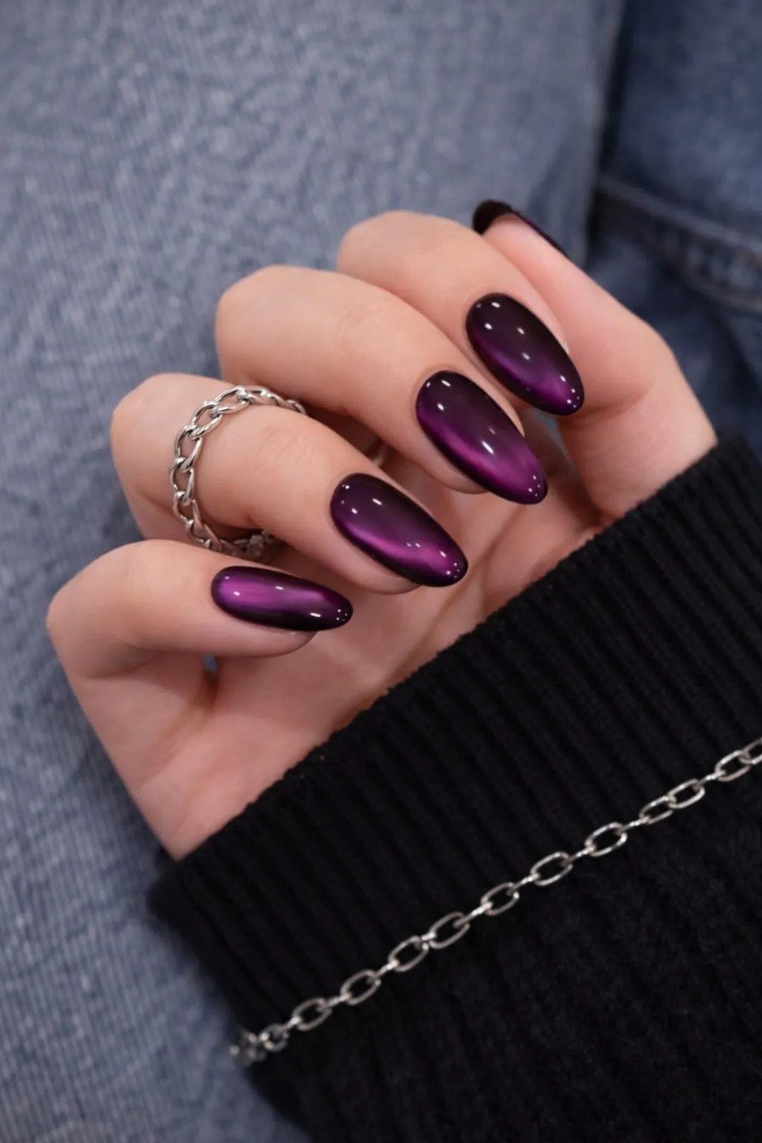 Deep plum cat eye, almond, with bracelet - nail ideas for women over 40