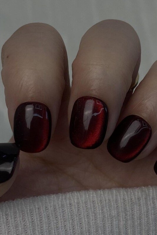 Black cherry cat eye, short oval - nail ideas for women over 40