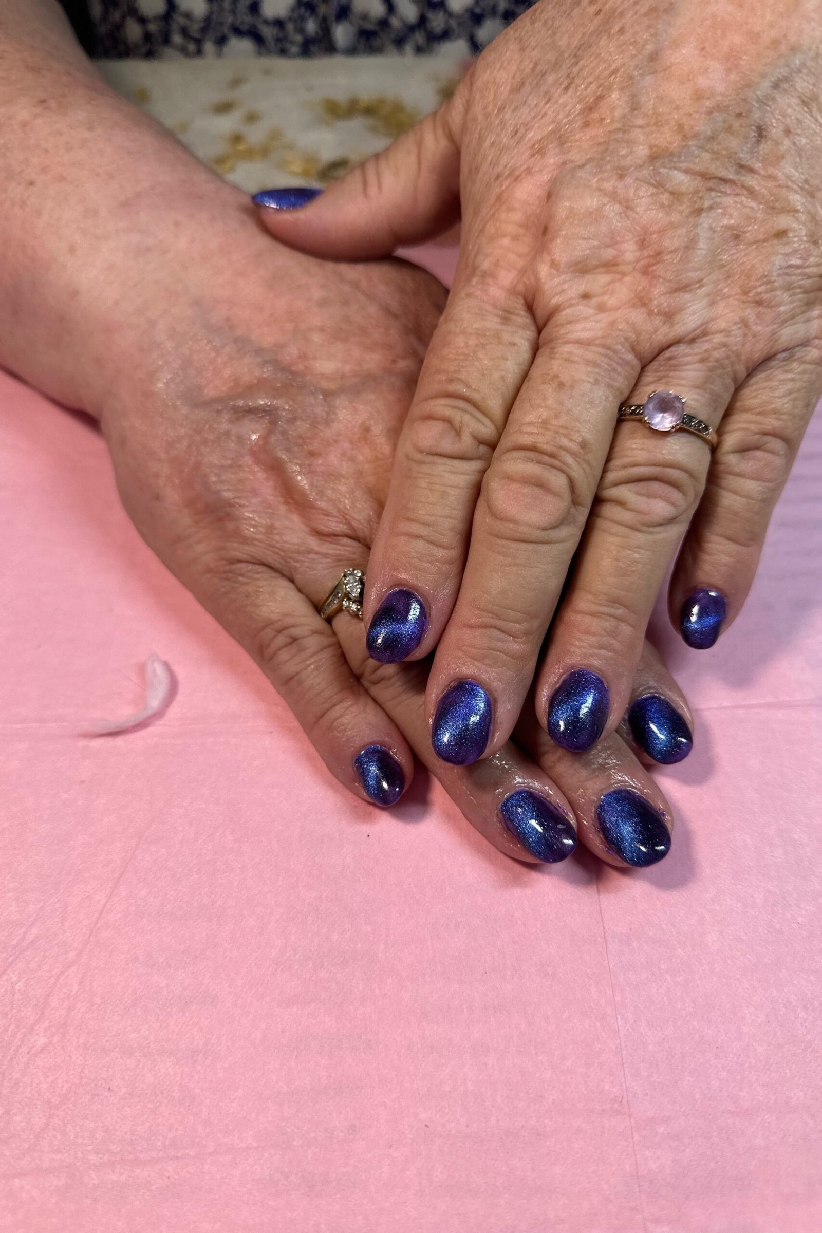 Navy blue cat eye, short rounded - nail ideas for women over 40