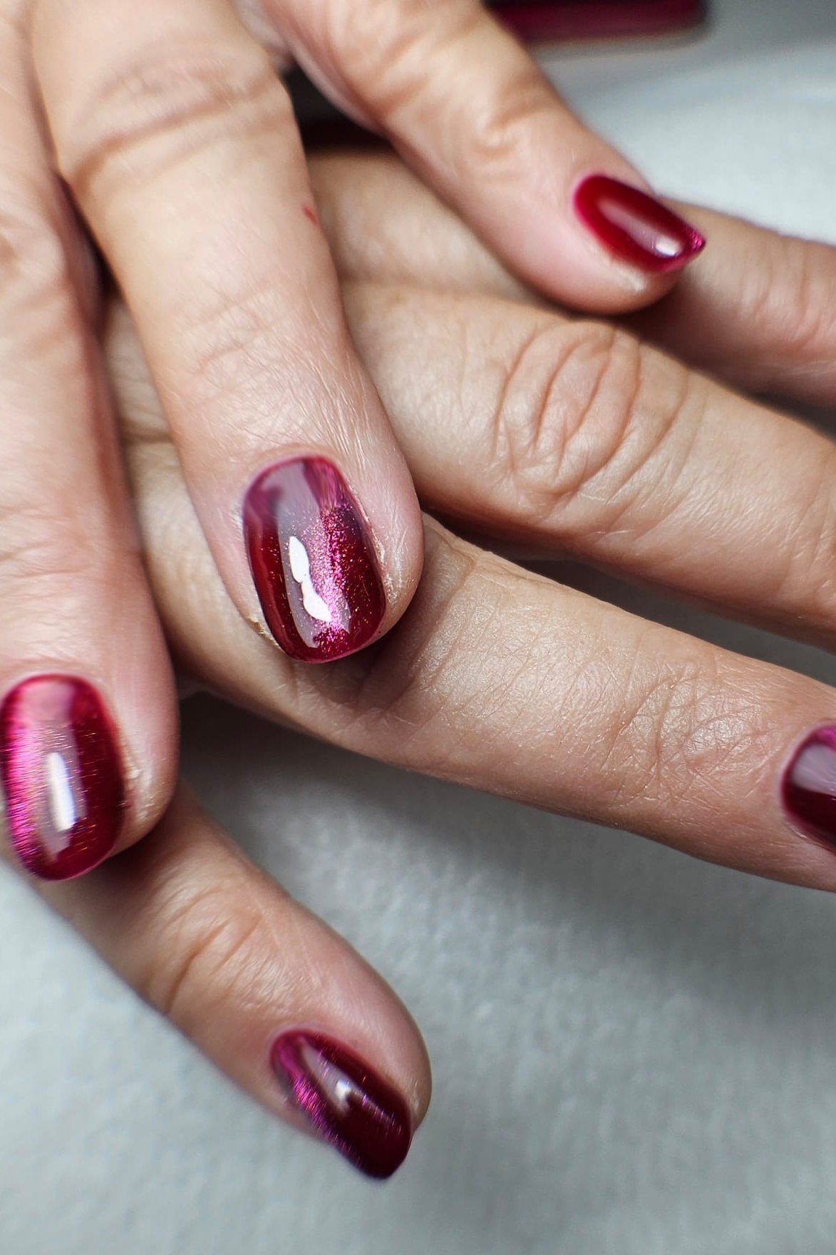 Burgundy cat eye, almond - nail ideas for women over 40