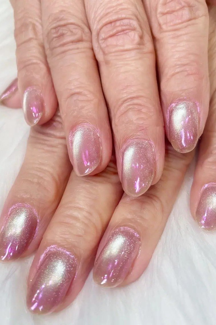 Pink mauve cat eye on mature hands - nail ideas for women over 40